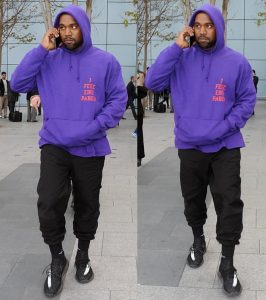 Kanye West wearing Yeezy Boost sneakers at Heathrow Airport in London on April 10, 2016
